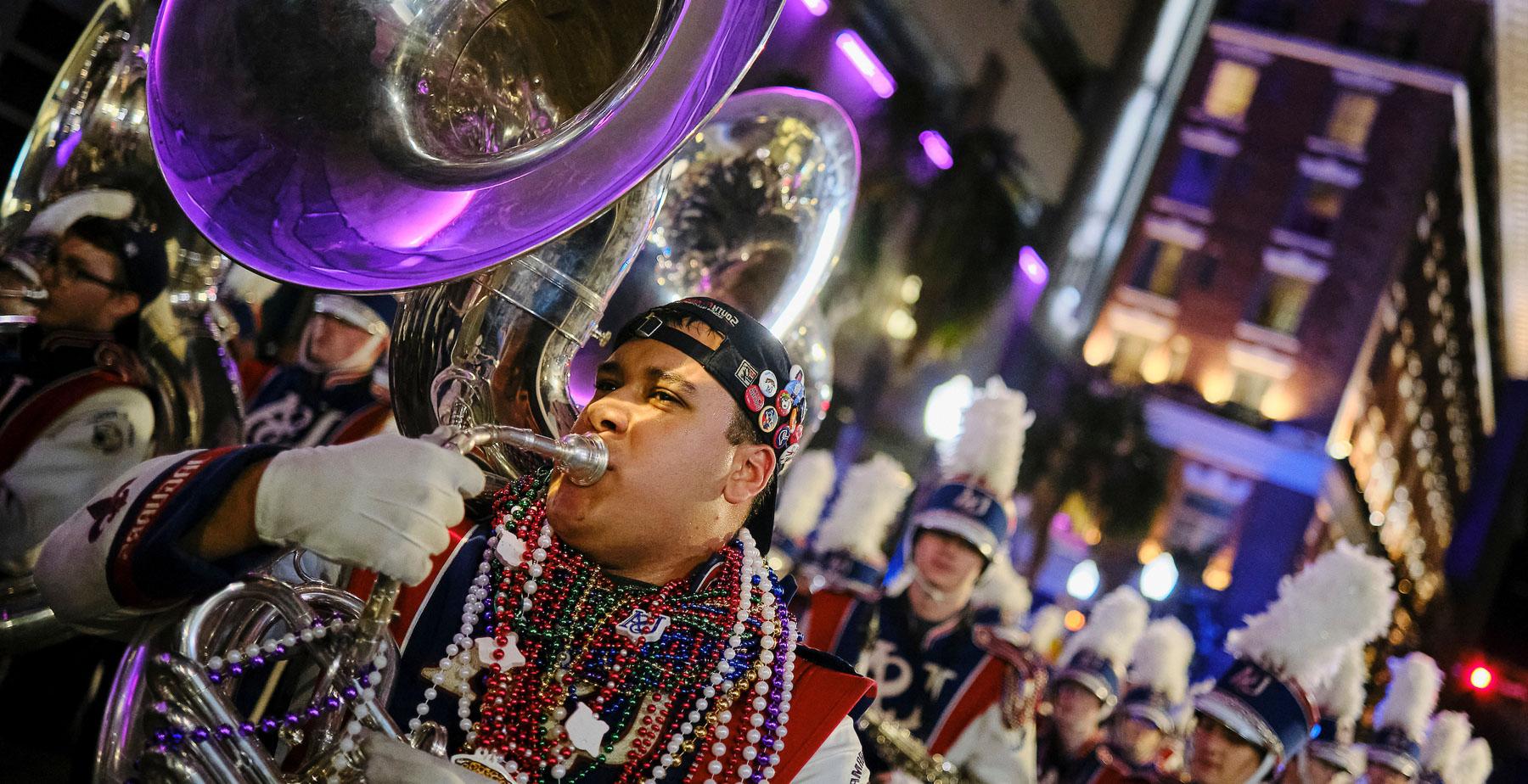 The Jaguar Marching Band marching with the Conde Cavaliers in downtown Mobile on Friday, Feb. 14, 2025.